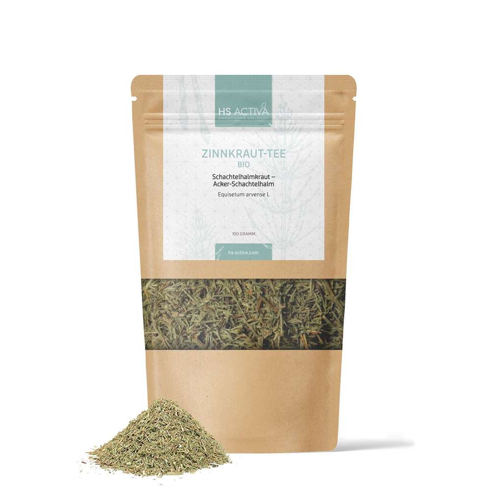 Product photography of HS Activa's 100-gram bag of organic Zinnkraut-Tee featuring a kraft paper pouch with teal and white labeling showcasing the dried herb and a small pile of the loose-leaf tea next to it
